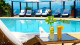 Costa do Sol Boutique Hotel - Relaxe à beira da piscina enquanto experimenta os refrescantes e exóticos drinks do bar!