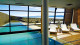 Design Suites Calafate - A convidativa piscina climatizada, de onde é possível apreciar a natureza intensa da região sem passar frio.