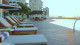 Grand Aston La Habana - No lazer, destaque para a piscina ao ar livre com espreguiçadeiras ao redor e panorama privilegiado do oceano.
