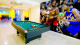 Impressive Resort - Enquanto a família toda aproveita a sala de jogos com videogames, ping-pong e pebolim!