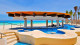 Omni Cancun Hotel e Villas - Peça um drink no bar da praia enquanto você curte o Mar do Caribe! 
