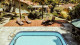 Pousada Recanto da Grande Paz - As opções de lazer incluem piscina externa com aquecimento solar e espreguiçadeiras, além de jardim com redário.
