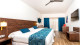 Riu Vallarta - O descanso é o destaque do apartamento Double Standard, de 30 m², com varanda, TV, AC, frigobar, máquina de café, etc.