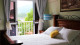 Pousada Villa Tenório - Os apartamentos são confortáveis e possuem varandas com cadeiras para apreciar a vista para o mar.