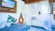 Pousada Vila Lua de Taipu - O Bangalô Superior conta com mezanino, varanda, minicozinha, Smart TV 32” e AC.